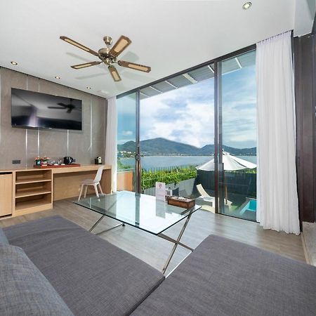 إندوتشين ريزورت آند فيلاز Patong المظهر الخارجي الصورة A living room at the hotel